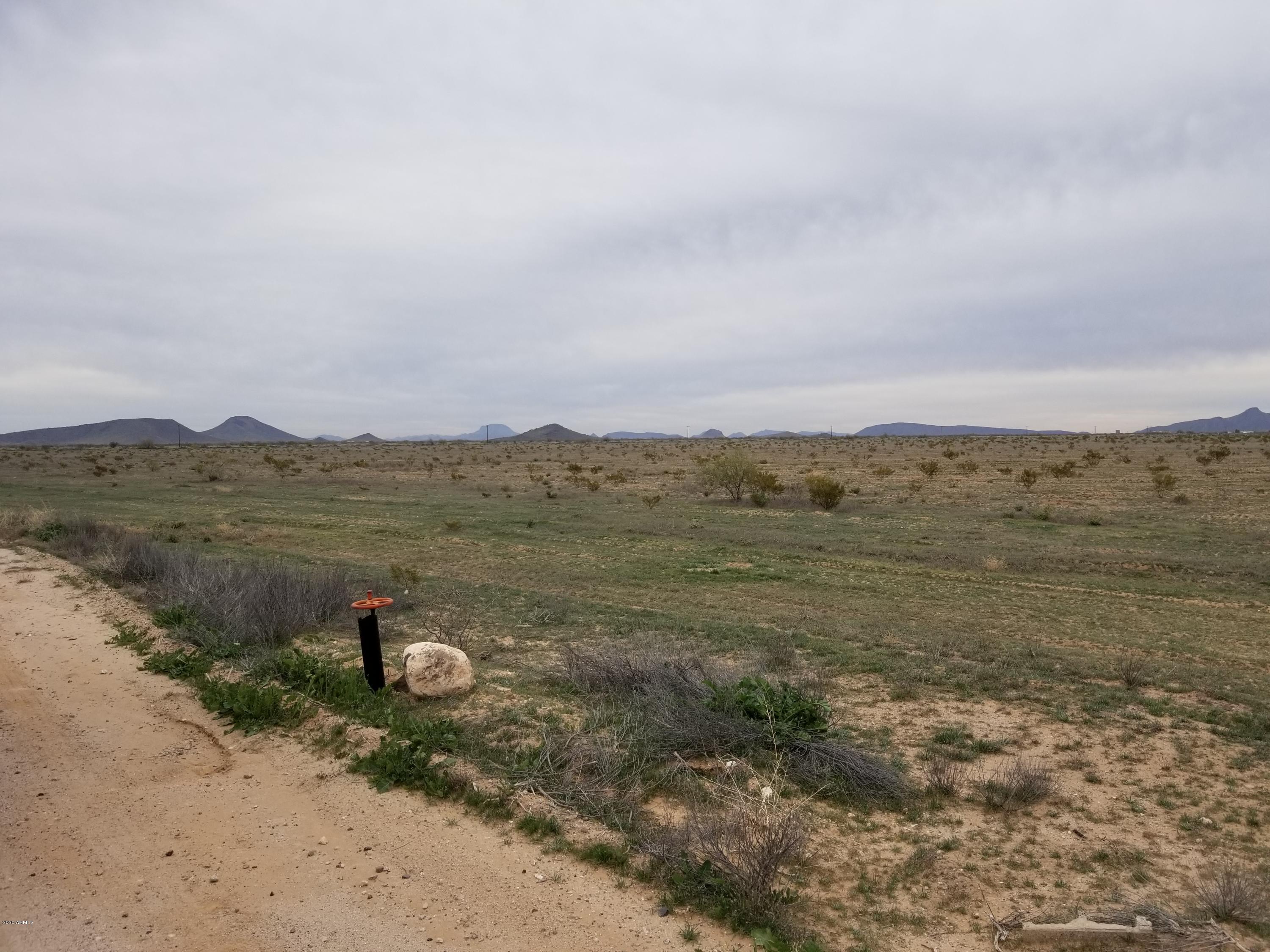 0 West Elliot Road Tonopah, AZ 85354 - Photo 17 of 25 a view of a lake with mountain in the background