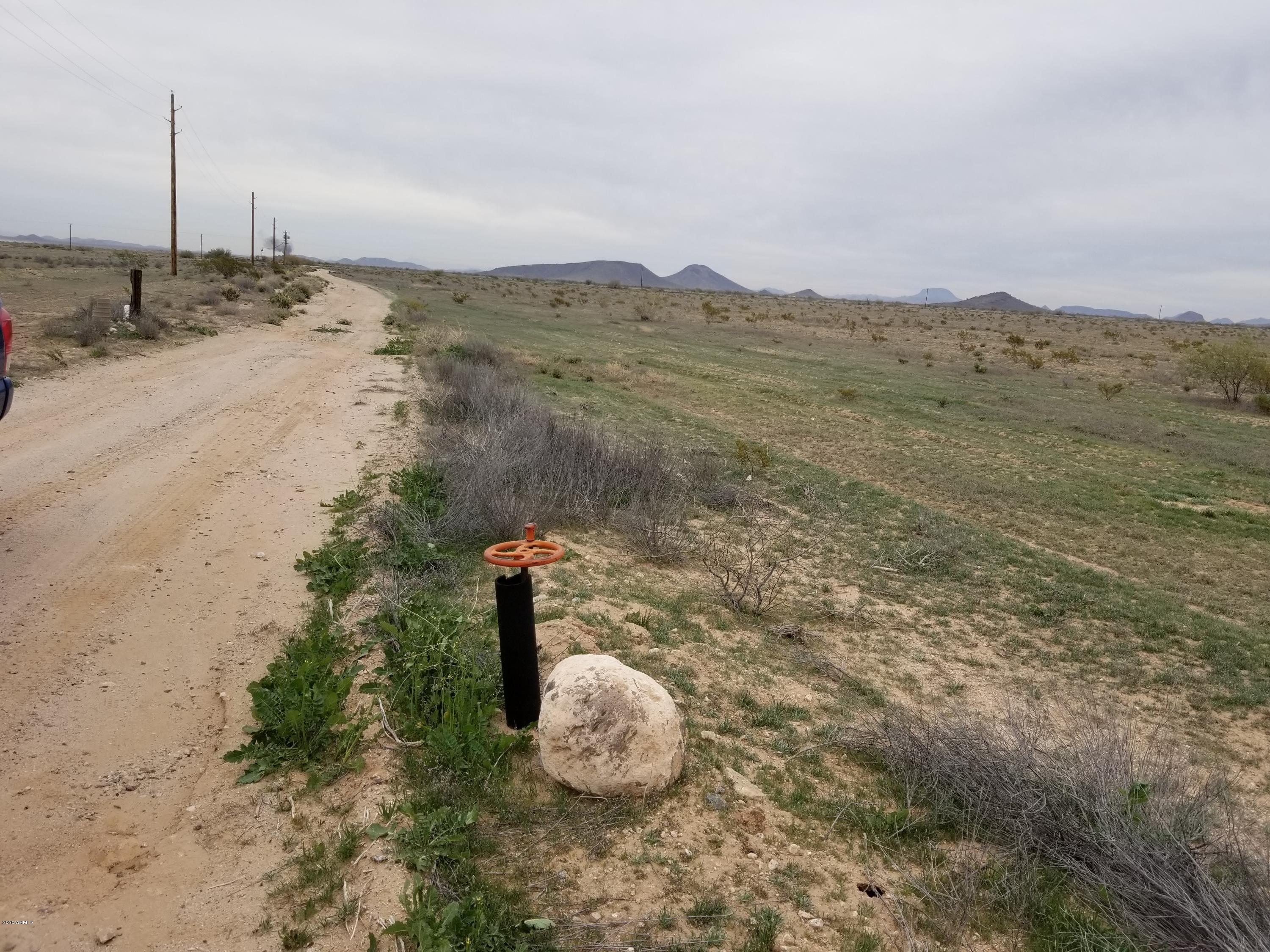 0 West Elliot Road Tonopah, AZ 85354 - Photo 18 of 25 a view of a dry yard with wooden fence