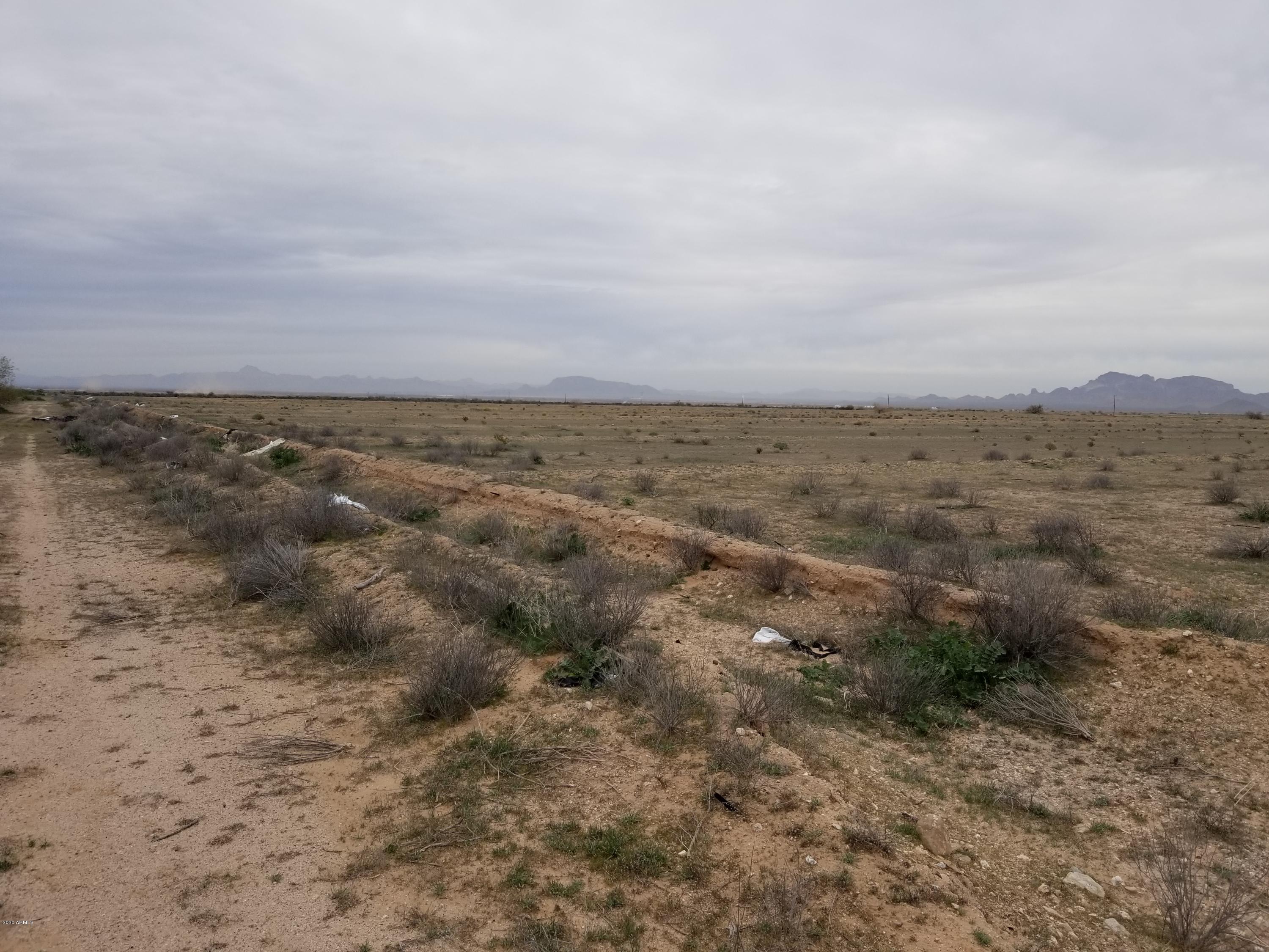 0 West Elliot Road Tonopah, AZ 85354 - Photo 7 of 25 an aerial view of houses covered in trees