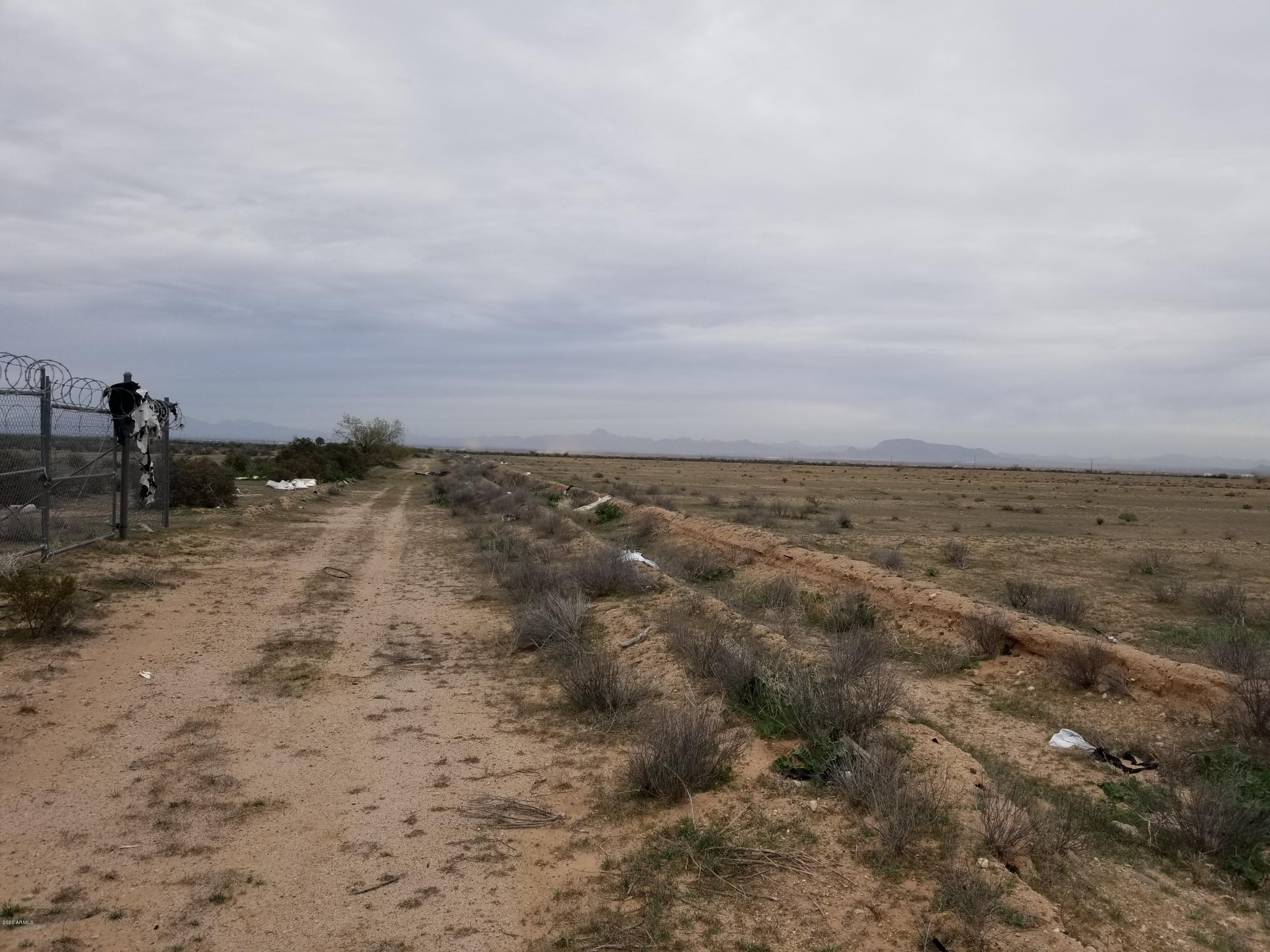 0 West Elliot Road Tonopah, AZ 85354 - Photo 8 of 25 a view of a beach with a building in back