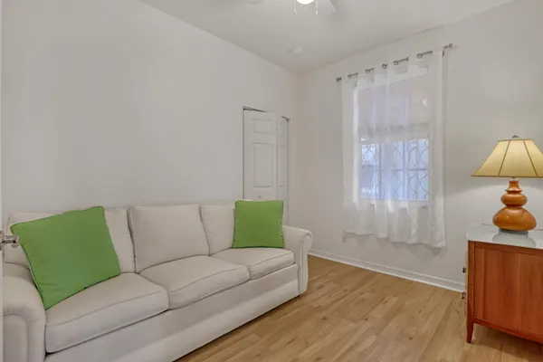 a living room with furniture and a window