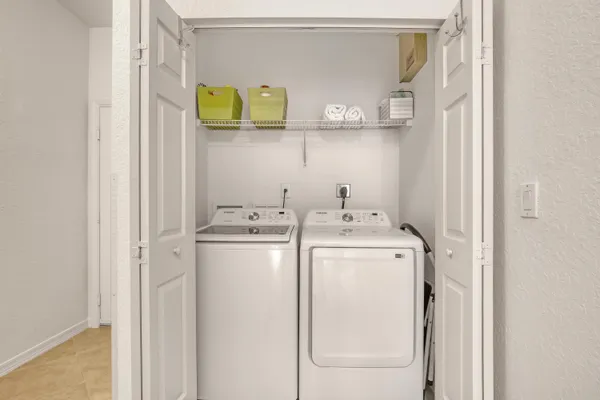 a utility room with dryer and washer