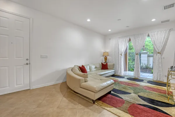 a living room with furniture and a rug