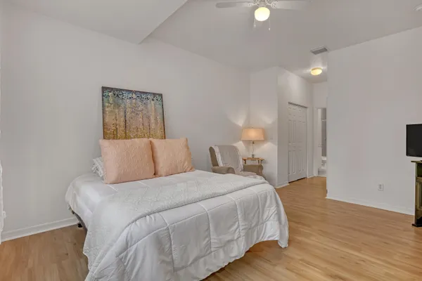 a large white bed in a white room