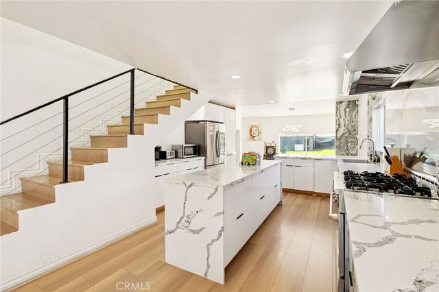 a bedroom with a bed and a desk