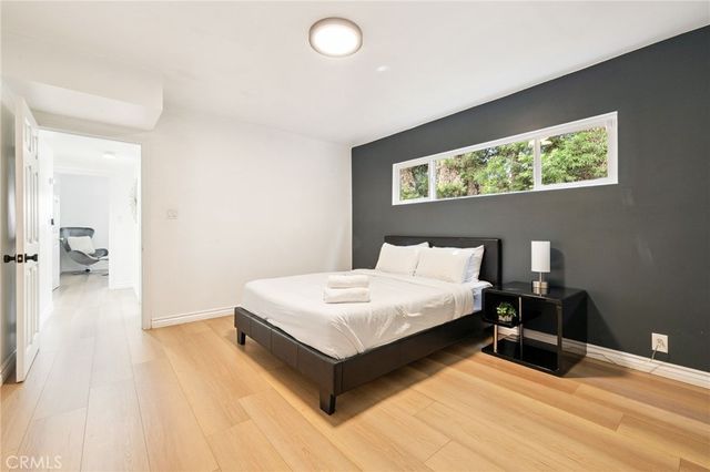 a bathroom with a double vanity sink a mirror and shower