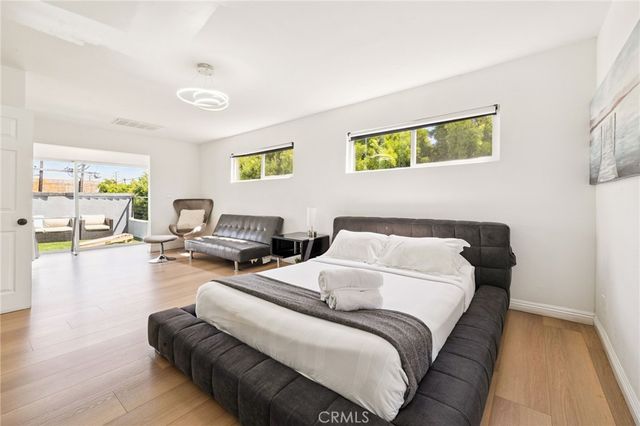 a room with furniture and a wooden floor