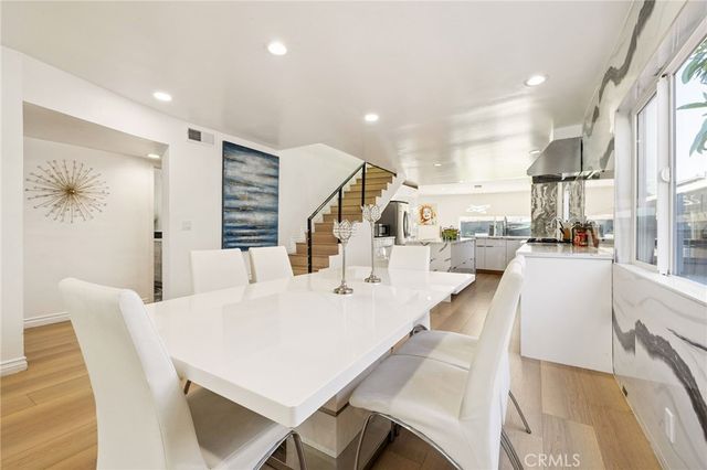 a large kitchen with lots of counter space and windows