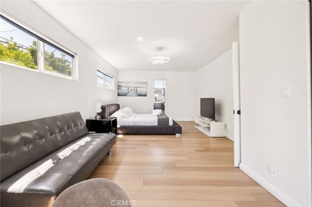 a bedroom with a bed and a cabinets