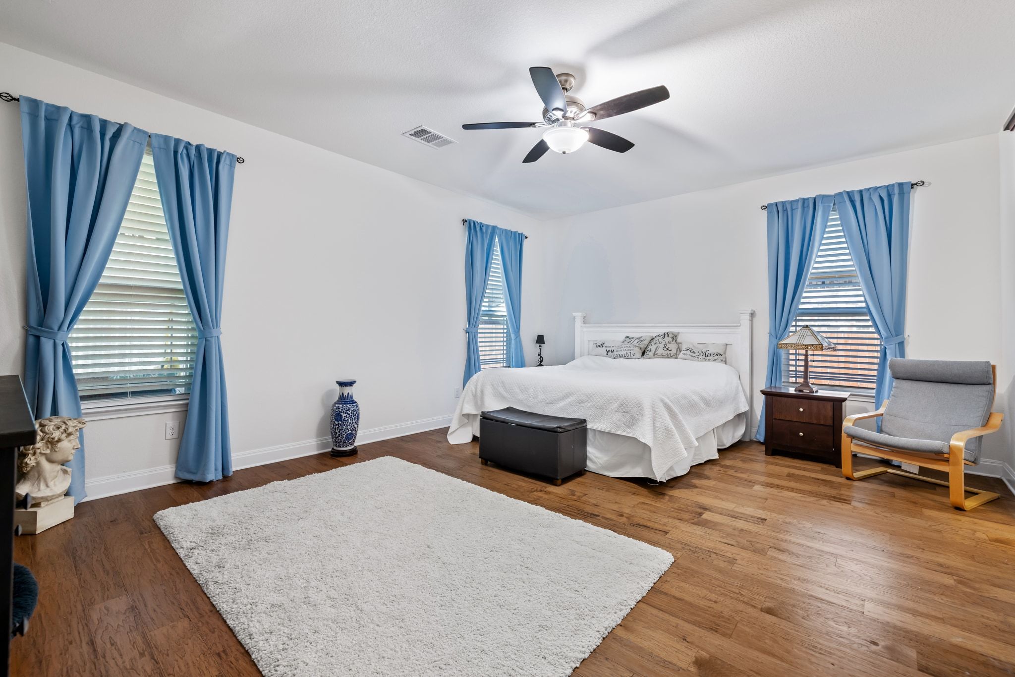 1022 Toltec Trail Georgetown, TX 78626 - Photo 18 of 37 Bedroom featuring dark wood-style floors and a ceiling fan