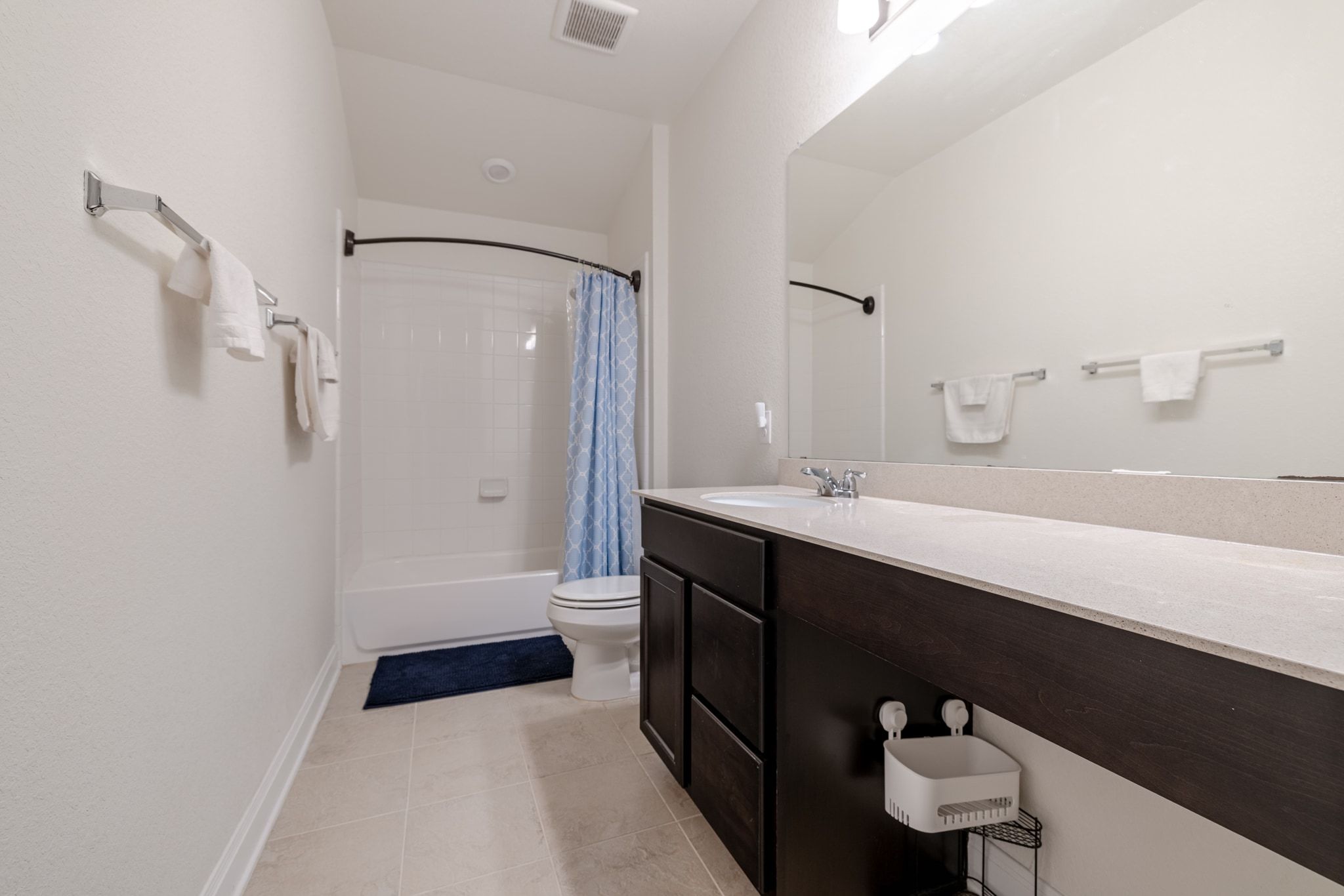 1022 Toltec Trail Georgetown, TX 78626 - Photo 24 of 37 Full bathroom with light tile patterned flooring, shower / tub combo, and vanity