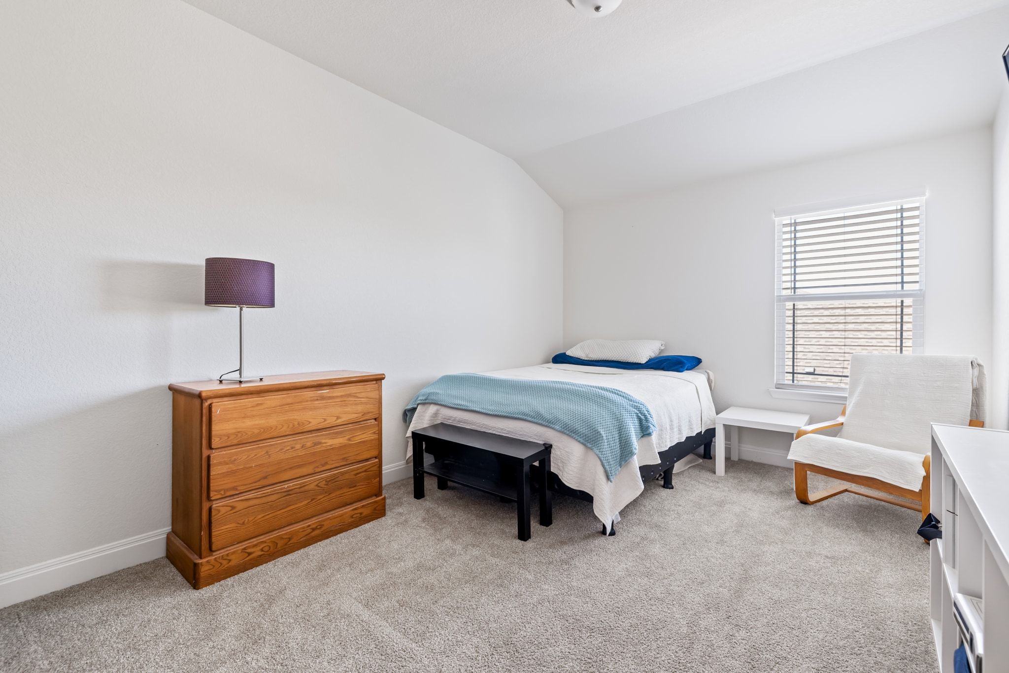 1022 Toltec Trail Georgetown, TX 78626 - Photo 26 of 37 Bedroom with light colored carpet and lofted ceiling