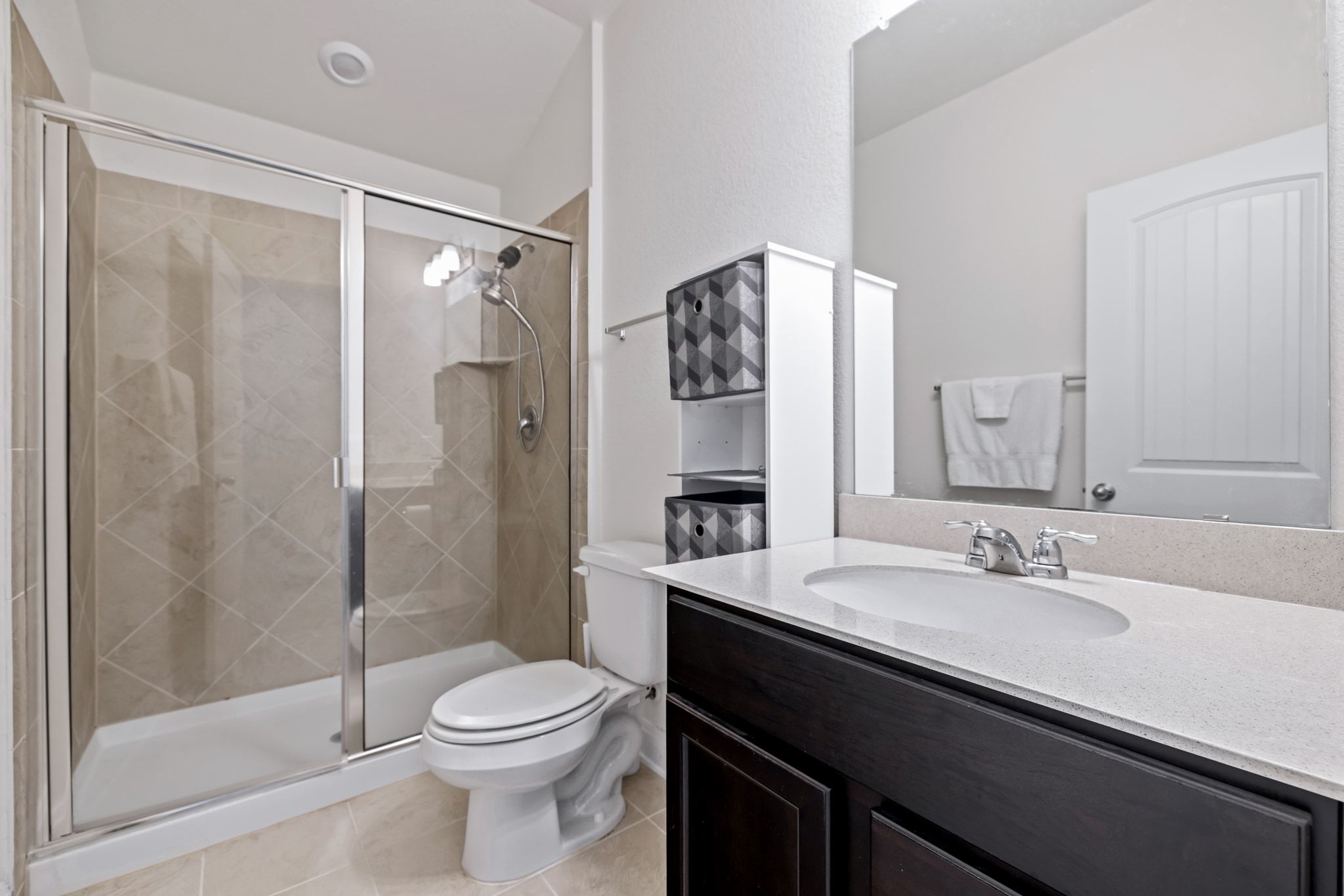 1022 Toltec Trail Georgetown, TX 78626 - Photo 27 of 37 Full bathroom featuring vanity, light tile patterned floors, and a shower stall