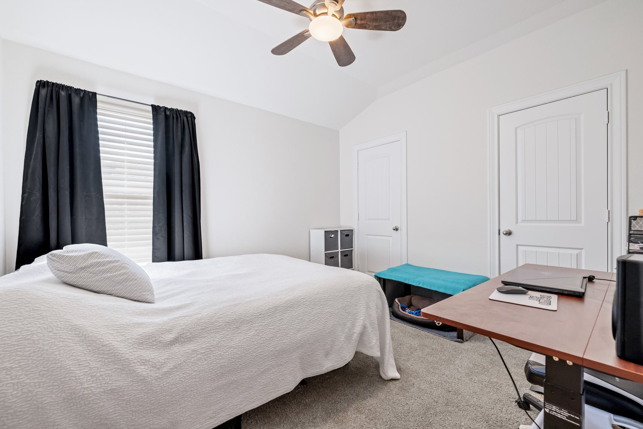 1022 Toltec Trail Georgetown, TX 78626 - Photo 28 of 37 Bedroom featuring carpet, lofted ceiling, a desk, and a ceiling fan