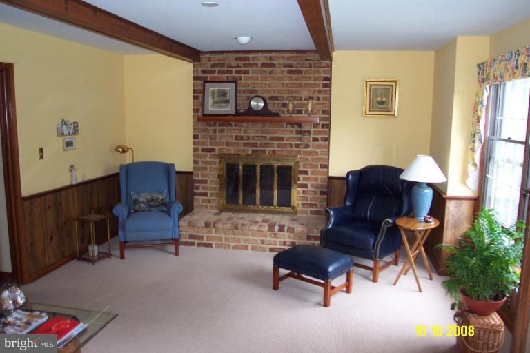 1015 Valewood Road Towson, MD 21286 - Photo 4 of 6 a living room with furniture and a fireplace
