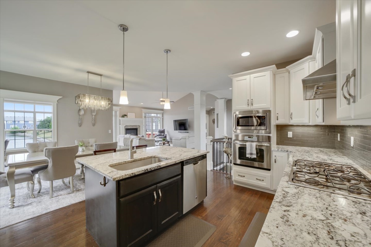 5104 Stonebridge Drive Champaign, IL 61822 - Photo 14 of 69 a open kitchen with stainless steel appliances granite countertop a sink stove and refrigerator