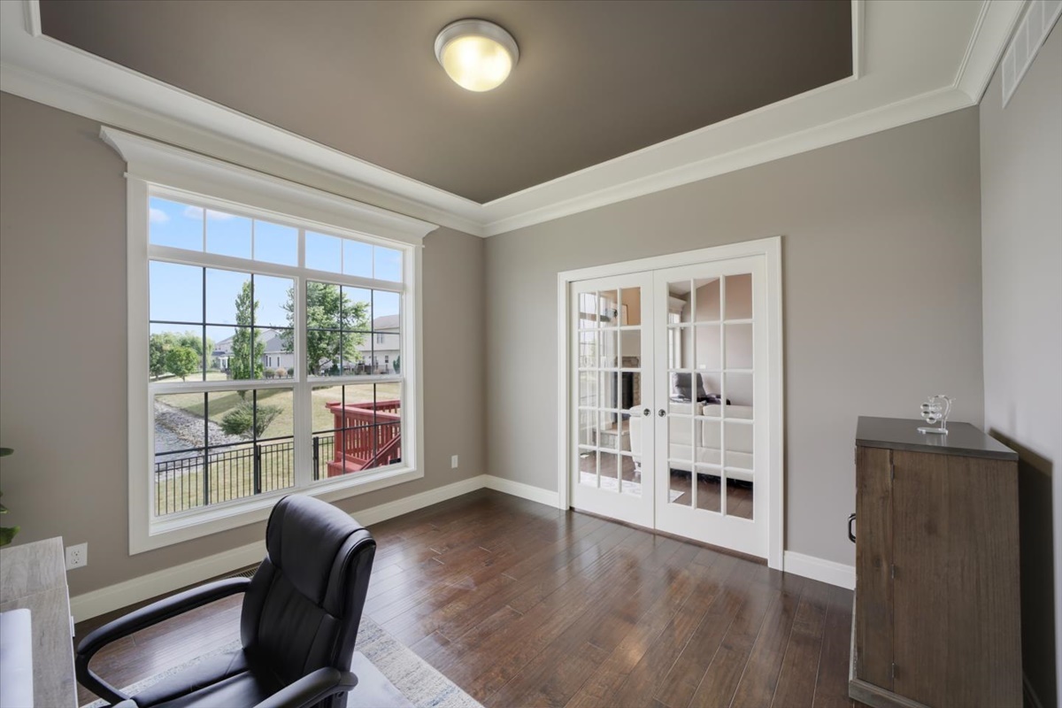 5104 Stonebridge Drive Champaign, IL 61822 - Photo 19 of 69 a workspace with wooden floor and windows