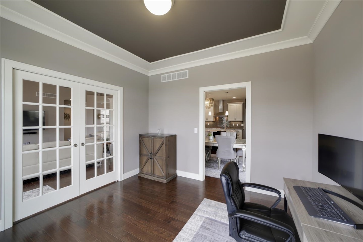 5104 Stonebridge Drive Champaign, IL 61822 - Photo 20 of 69 a view of a workspace with furniture and wooden floor