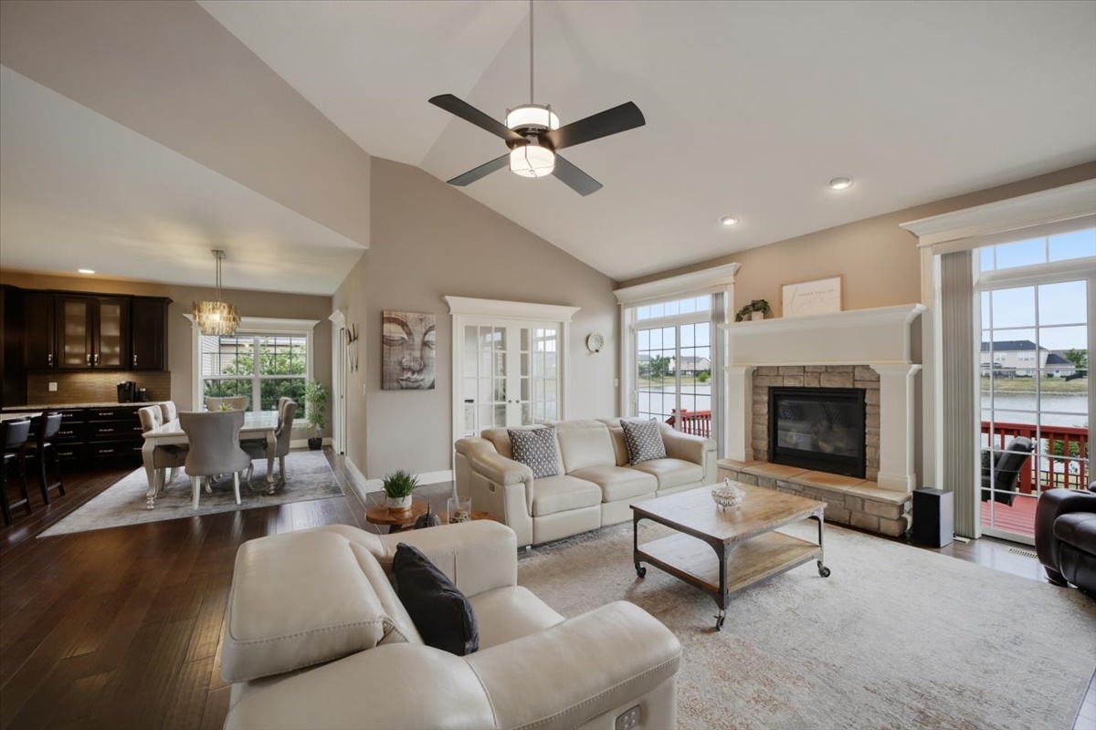 5104 Stonebridge Drive Champaign, IL 61822 - Photo 22 of 69 a living room with furniture a fireplace and a flat screen tv