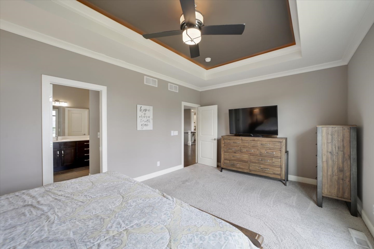 5104 Stonebridge Drive Champaign, IL 61822 - Photo 25 of 69 a bedroom with furniture and a flat screen tv