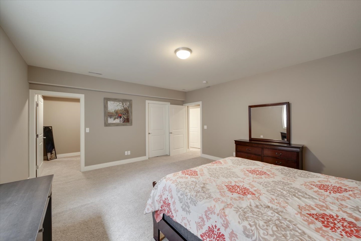 5104 Stonebridge Drive Champaign, IL 61822 - Photo 41 of 69 a bedroom with a bed and a painting on the wall