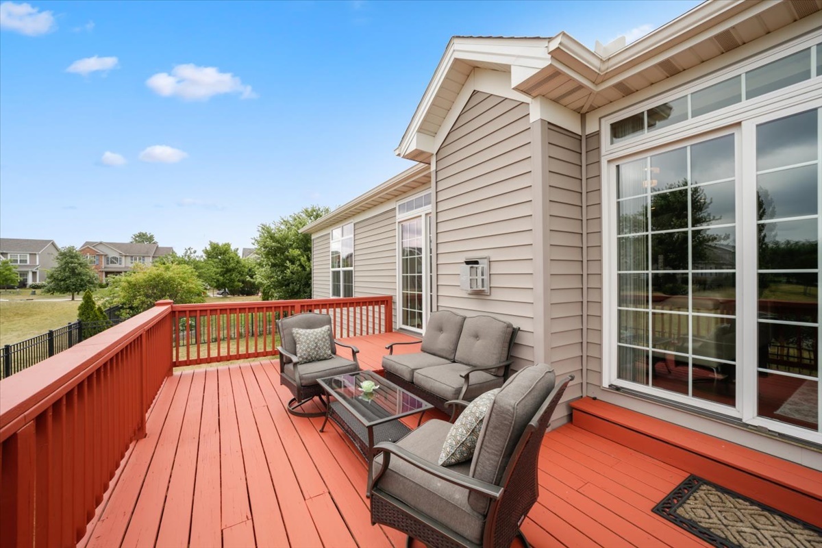 5104 Stonebridge Drive Champaign, IL 61822 - Photo 56 of 69 a view of a roof deck with couches and wooden floor