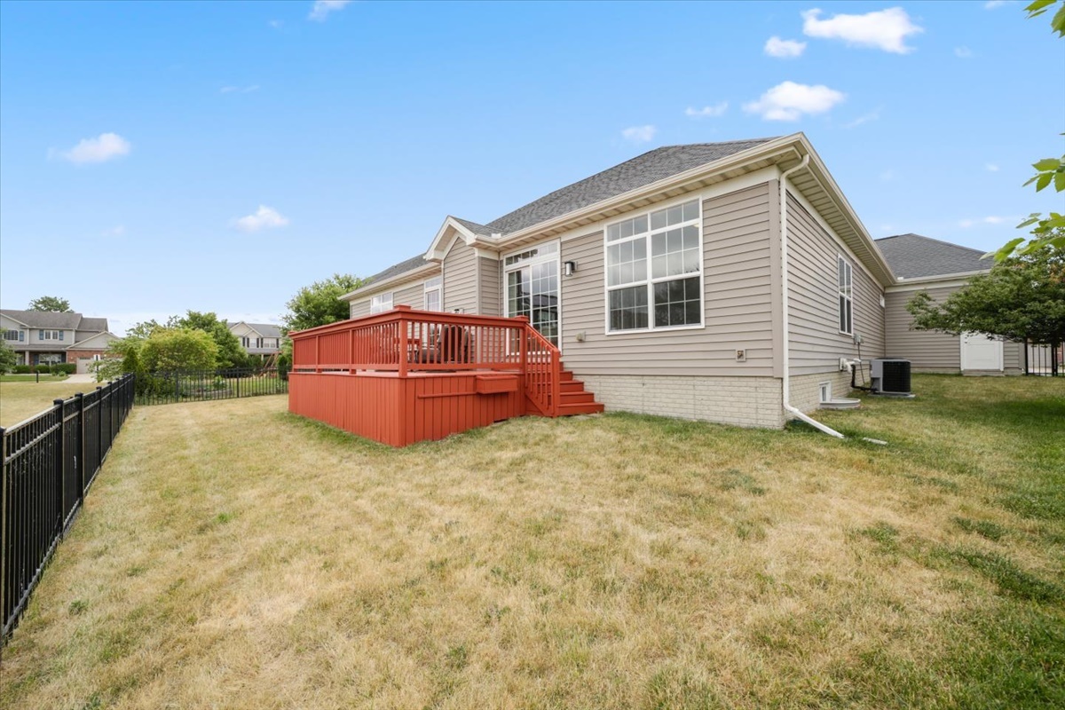 5104 Stonebridge Drive Champaign, IL 61822 - Photo 57 of 69 a backyard of a house with table and chairs