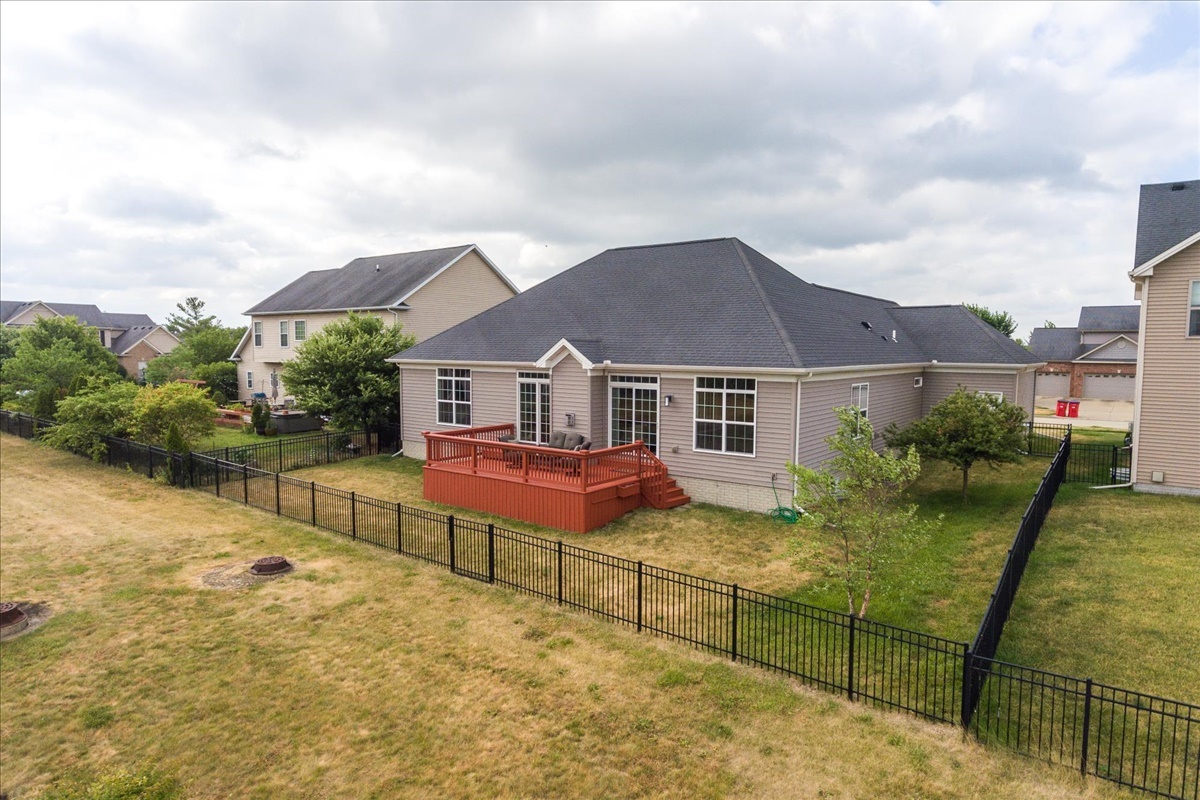 5104 Stonebridge Drive Champaign, IL 61822 - Photo 68 of 69 a aerial view of a house with table and chairs under an umbrella