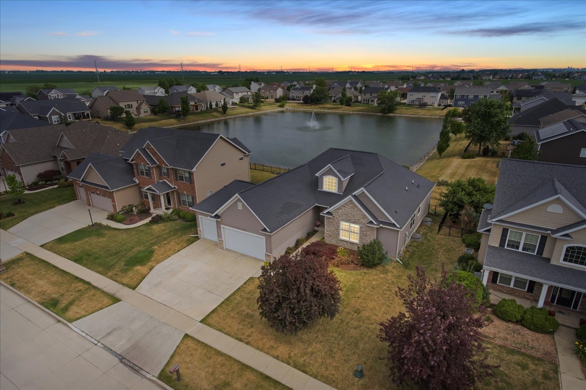 5104 Stonebridge Drive Champaign, IL 61822 - Photo 8 of 69 an aerial view of a house with a lake view