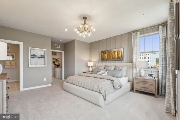 a bedroom with bed and window