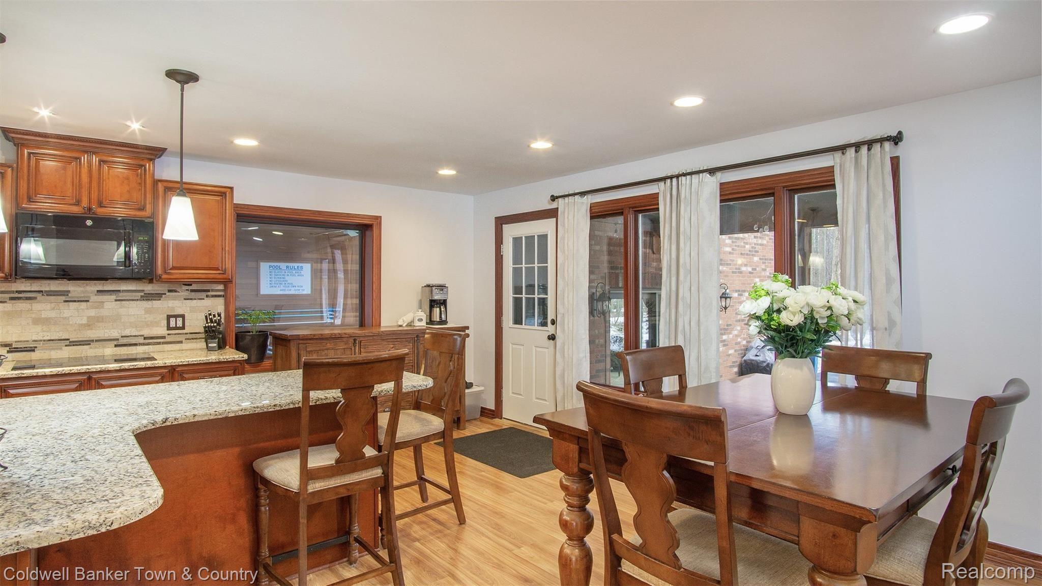 5186 Golf Club Road Howell, MI 48843 - Photo 10 of 30 Kitchen with Island and Eating Area