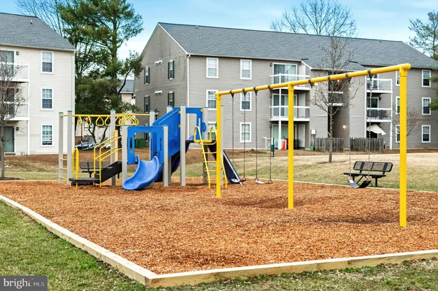 a view of a swimming pool with an outdoor seating and a garden