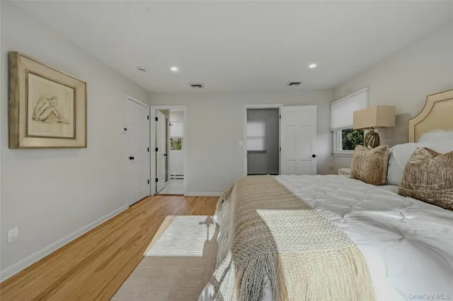 an empty room with a empty space and windows