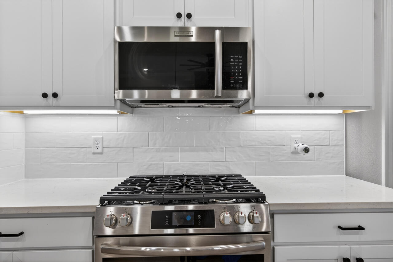 155 Lumen Loop Freeport, FL 32439 - Photo 13 of 48 a stove top oven sitting inside of a kitchen