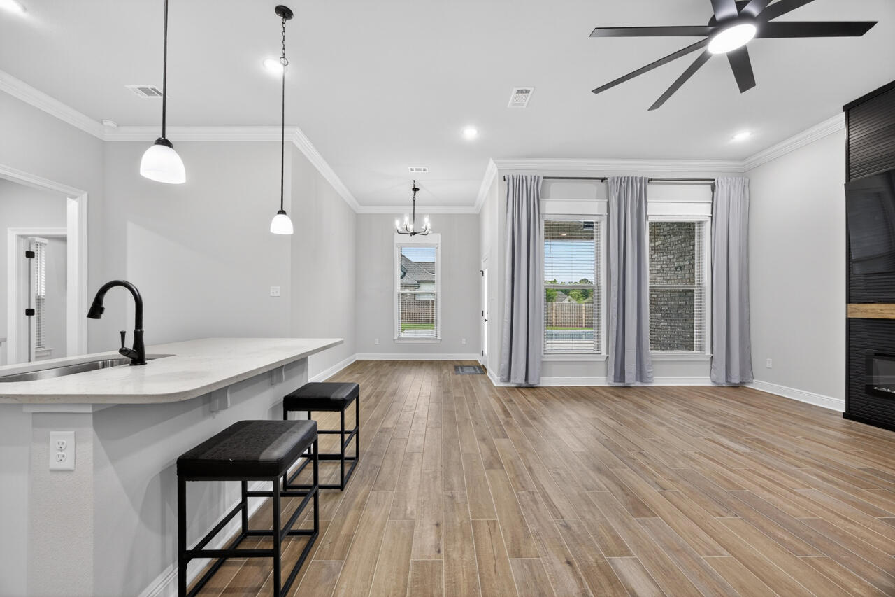 155 Lumen Loop Freeport, FL 32439 - Photo 14 of 46 a view of a kitchen with a sink and wooden floor