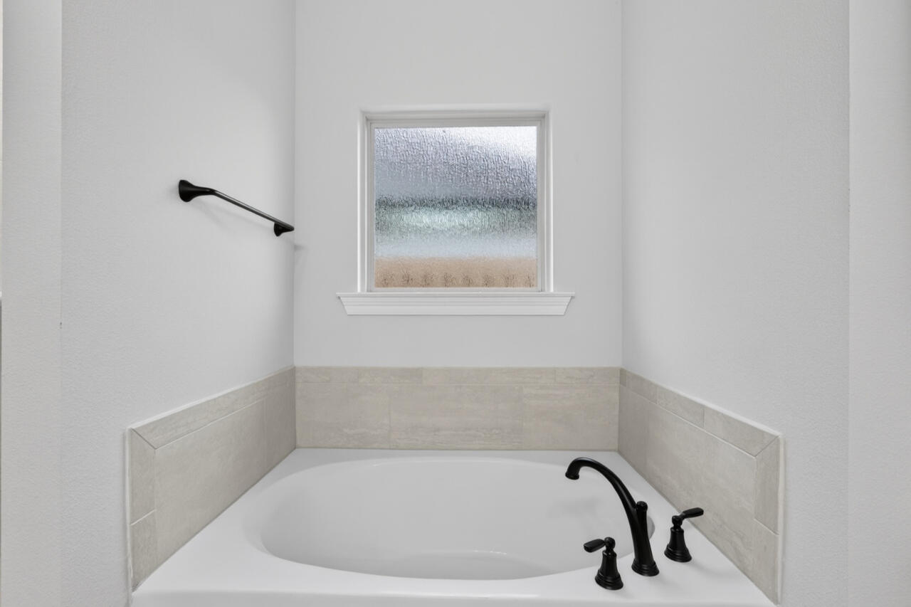 155 Lumen Loop Freeport, FL 32439 - Photo 21 of 46 a bathroom with a bathtub