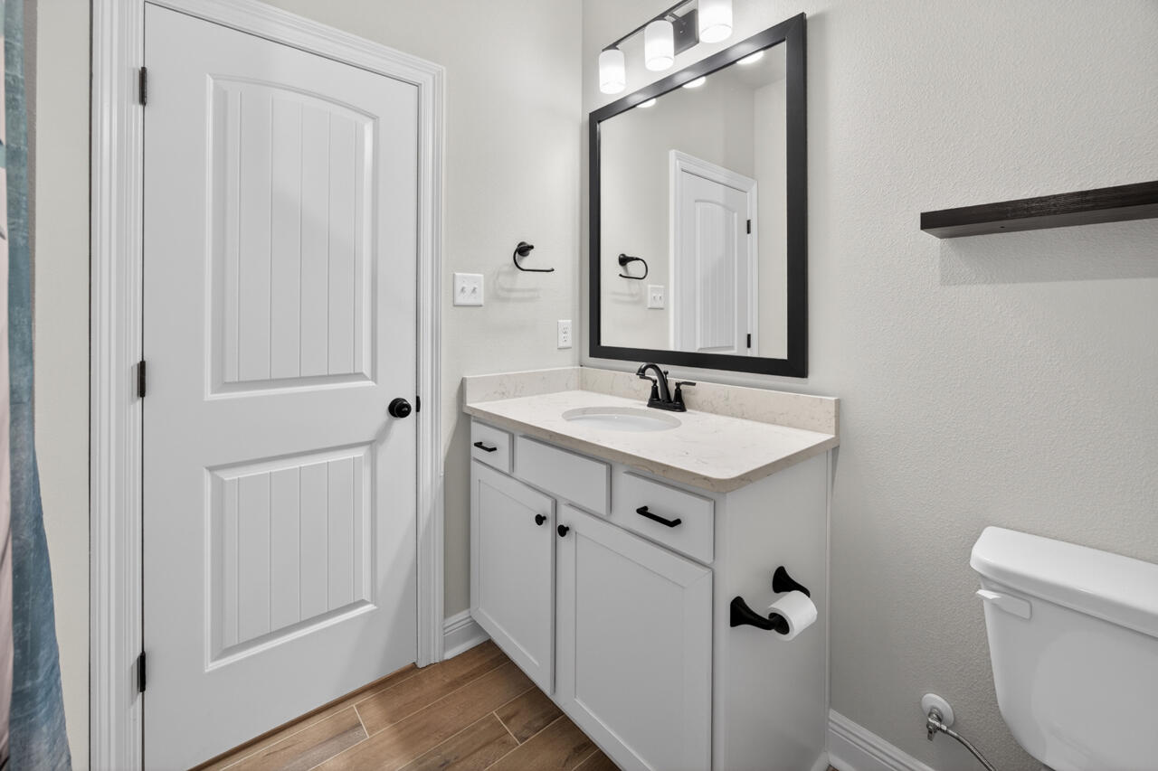 155 Lumen Loop Freeport, FL 32439 - Photo 29 of 48 a bathroom with a sink mirror and toilet