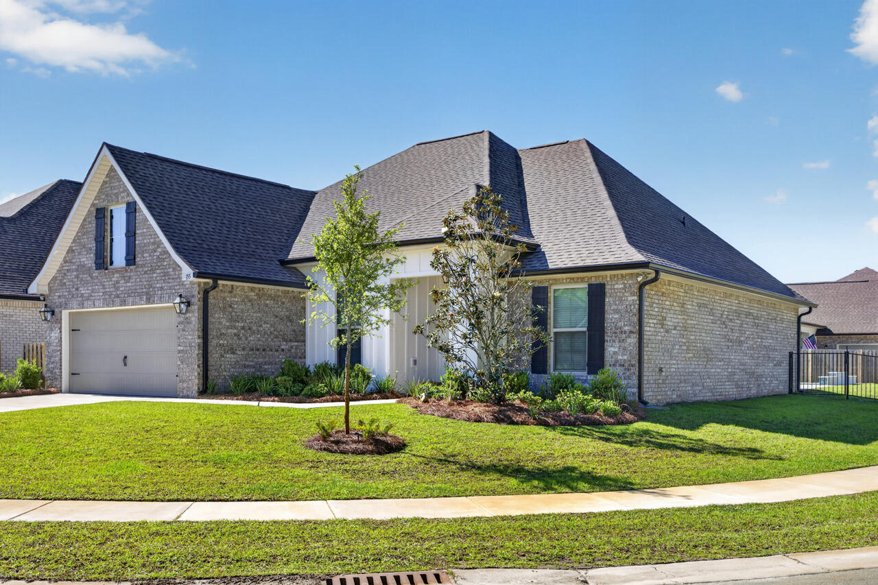 155 Lumen Loop Freeport, FL 32439 - Photo 3 of 46 a front view of a house with a yard