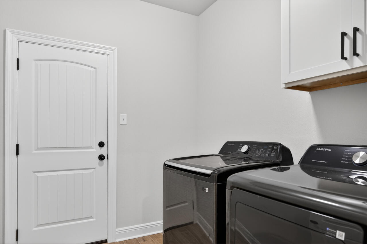 155 Lumen Loop Freeport, FL 32439 - Photo 32 of 46 a utility room with dryer and washer