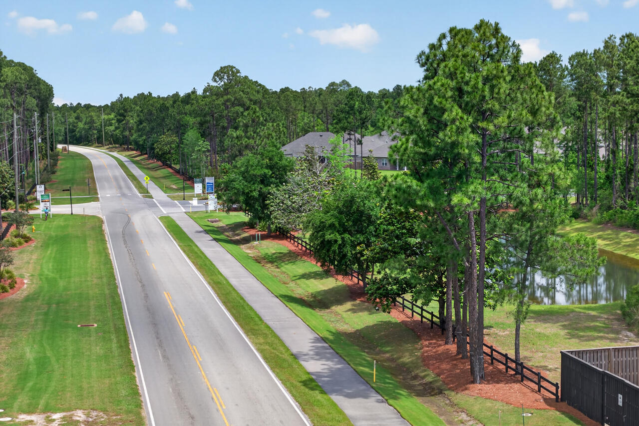 155 Lumen Loop Freeport, FL 32439 - Photo 45 of 48 a view of a lake with a yard