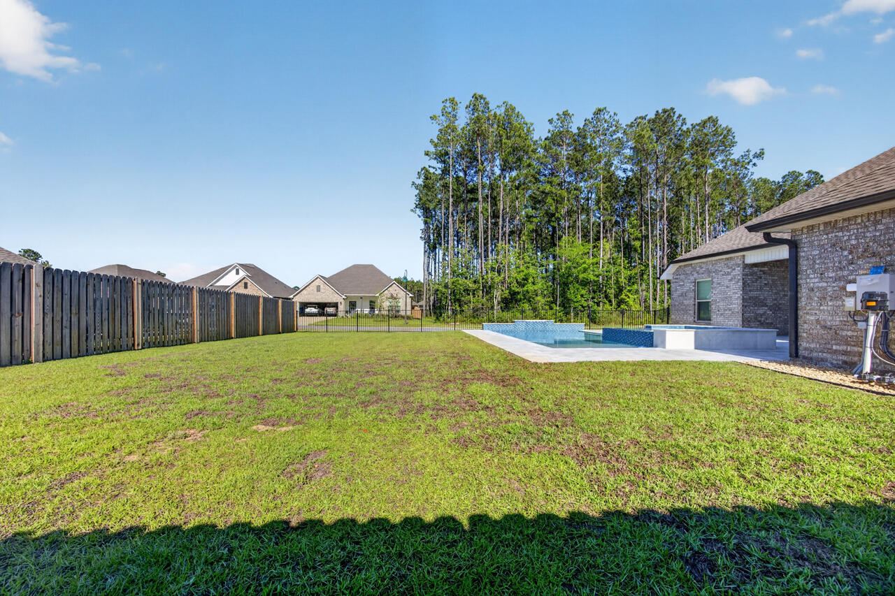 155 Lumen Loop Freeport, FL 32439 - Photo 46 of 46 a view of a house with a swimming pool