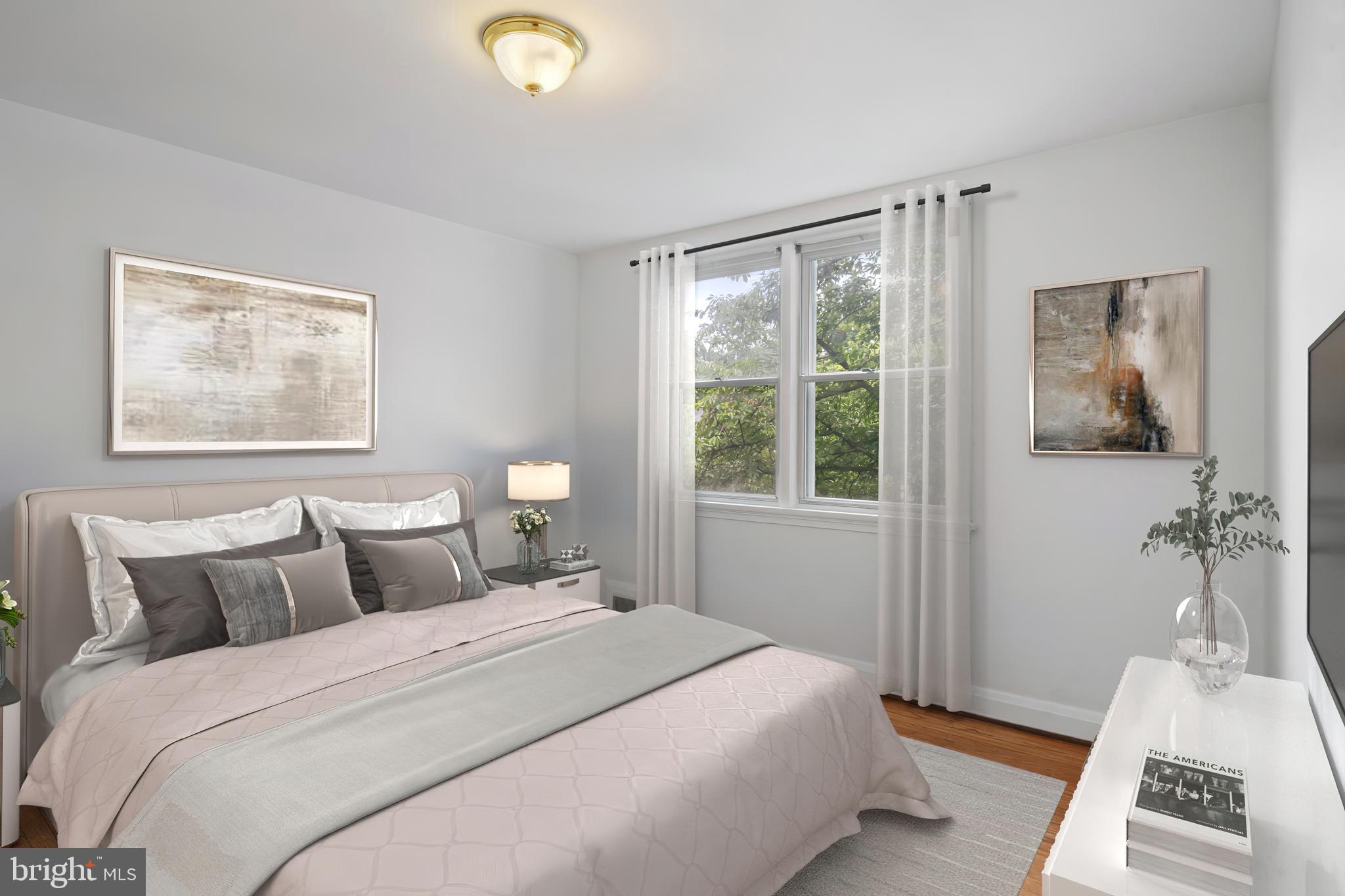 840 Evesham Avenue Baltimore, MD 21212 - Photo 11 of 20 a bedroom with a bed and a window