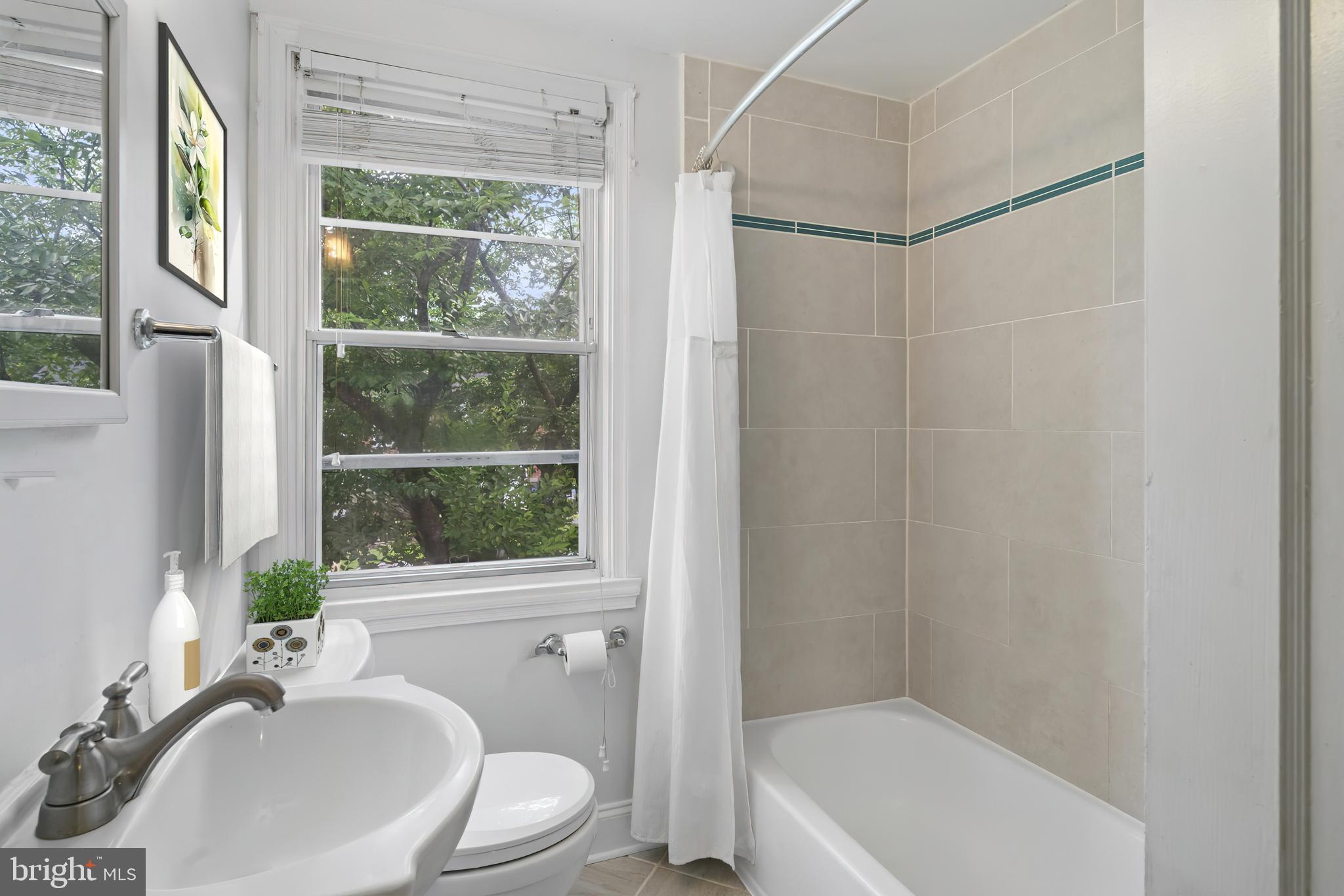 840 Evesham Avenue Baltimore, MD 21212 - Photo 12 of 20 a bathroom with a sink toilet and shower