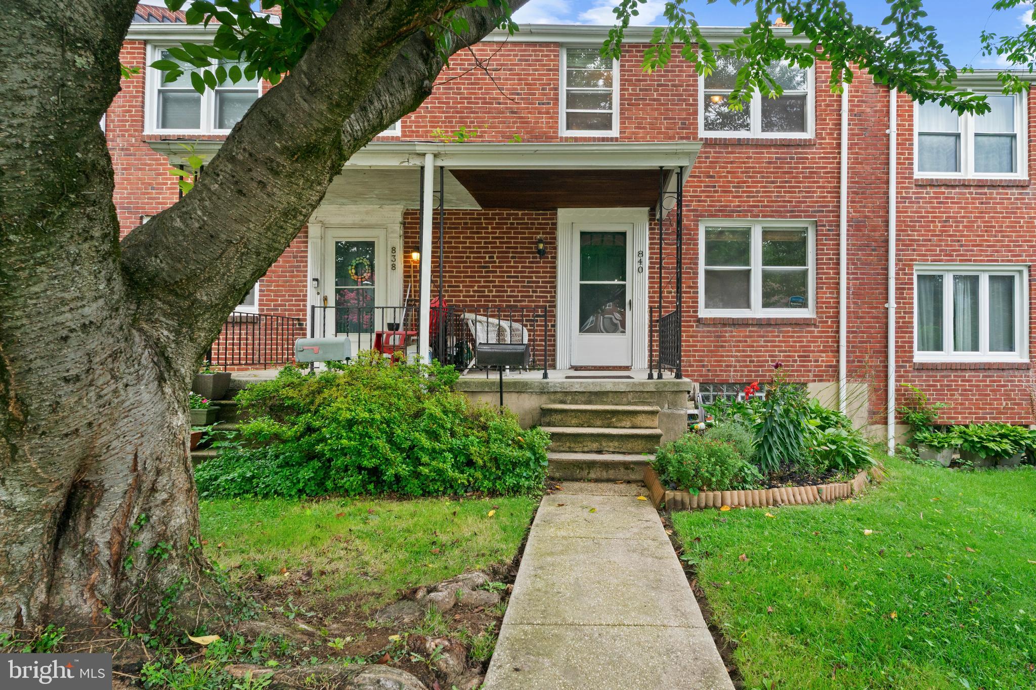 840 Evesham Avenue Baltimore, MD 21212 - Photo 2 of 20 a view of brick house with a yard and plants