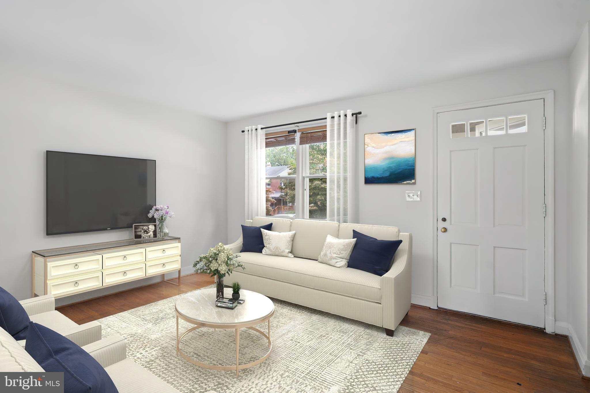 840 Evesham Avenue Baltimore, MD 21212 - Photo 6 of 20 a living room with furniture and a flat screen tv