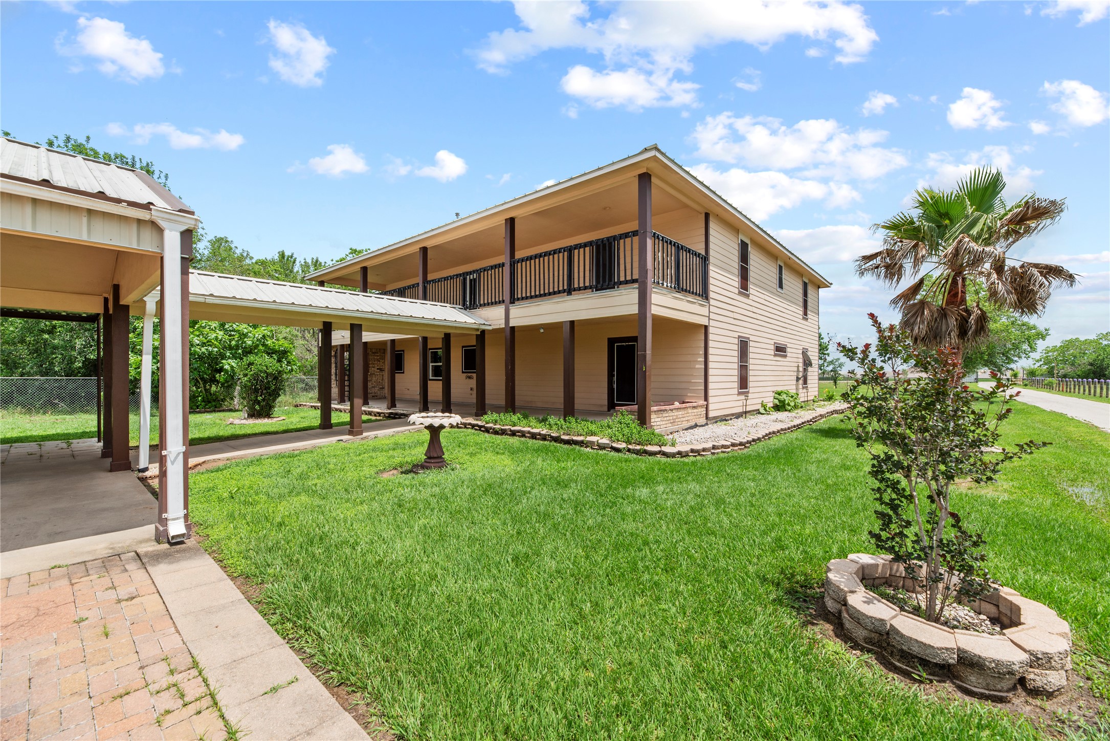 523 Moore Bar Road Rosenberg, TX 77471 - Photo 8 of 50 Covered breezeway between carport/garage and the house.