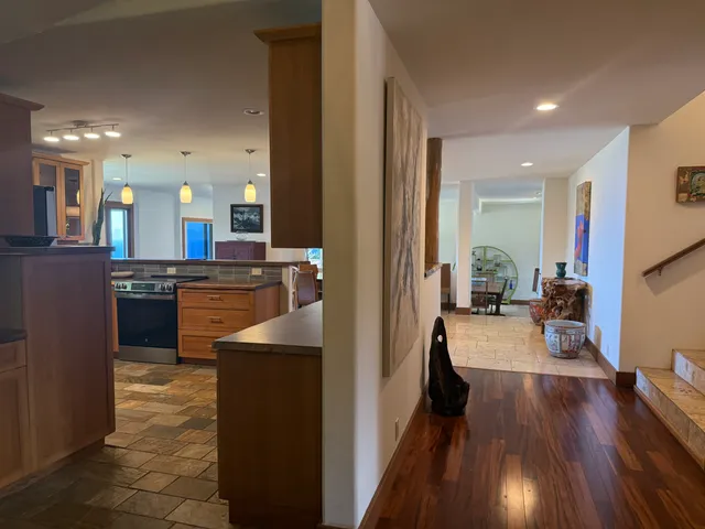 a kitchen with counter top space a sink and appliances