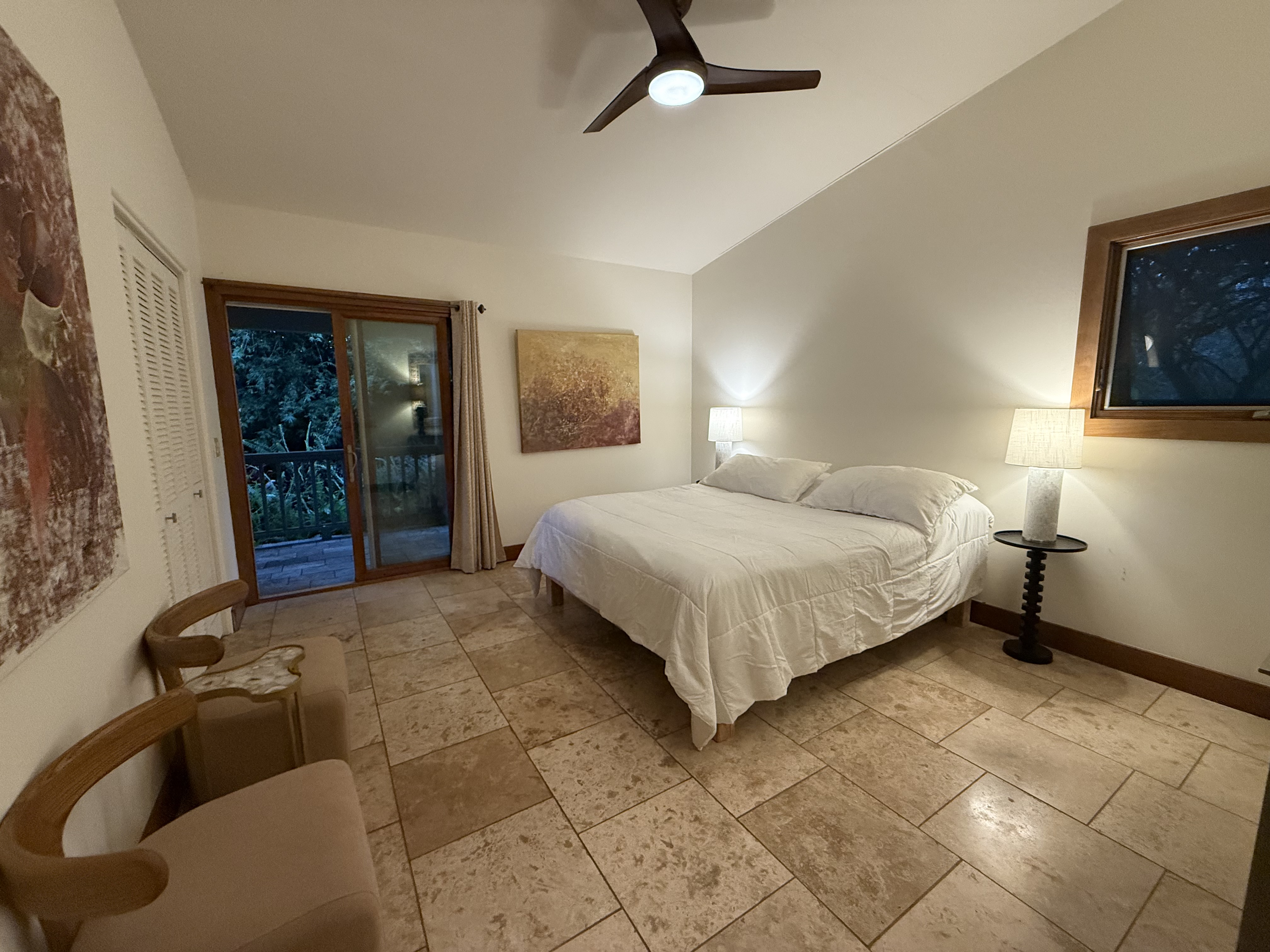 48-5528 Waipio Valley Road Honokaa, HI 96727 - Photo 13 of 18 a bedroom with a bed and a potted plant on the dresser