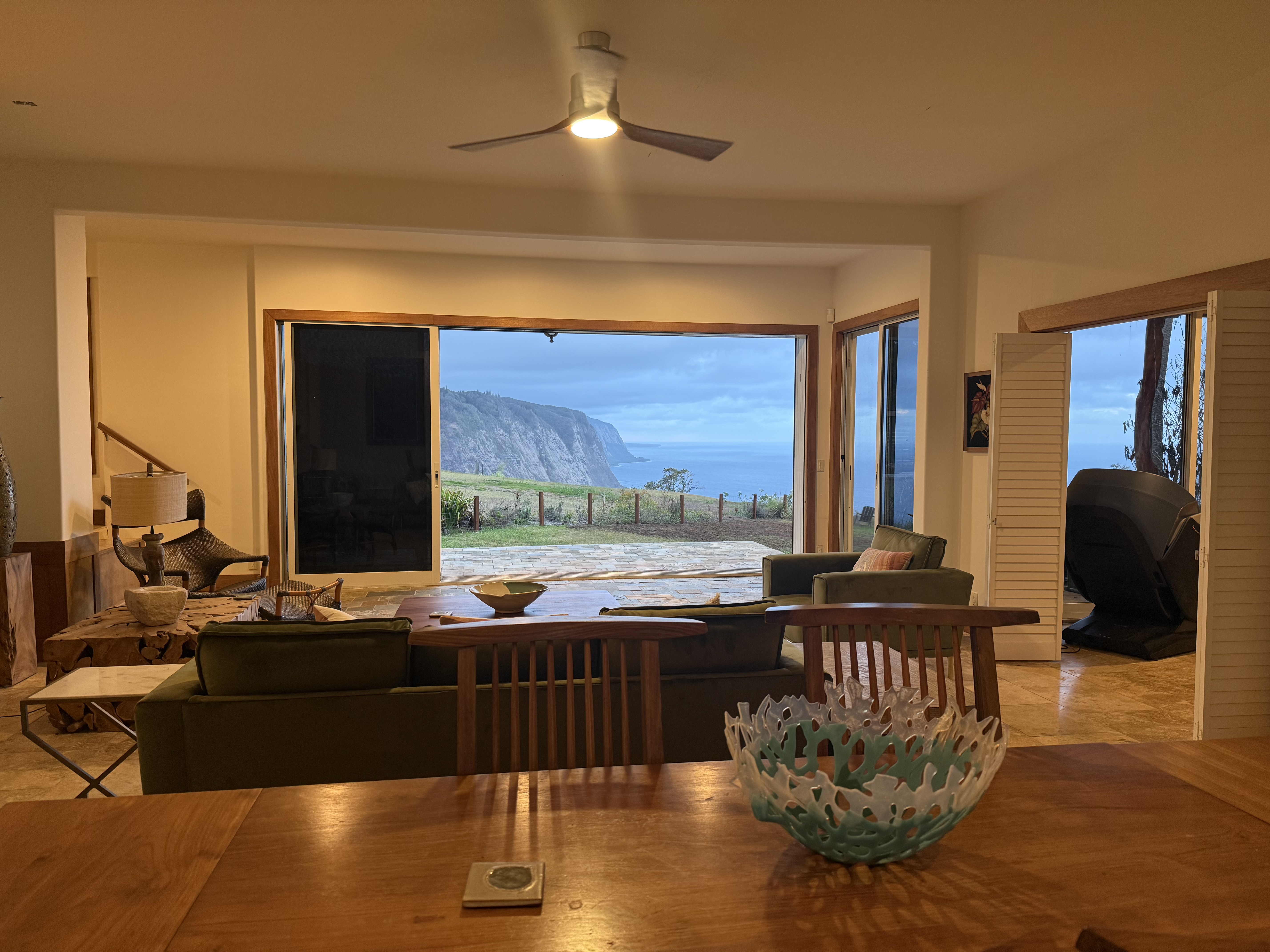 48-5528 Waipio Valley Road Honokaa, HI 96727 - Photo 8 of 18 a living room with couches chairs and a large window with outer view