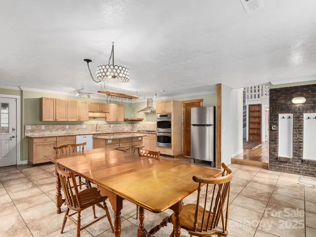 a view of a livingroom with wooden floor and fireplace